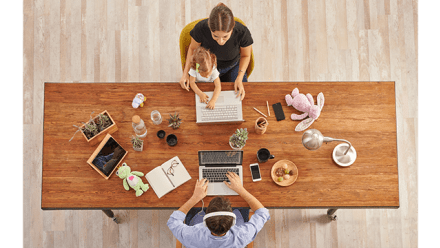 Couple working from home with them child, wooden table, laptop toy and lamp, up concept.